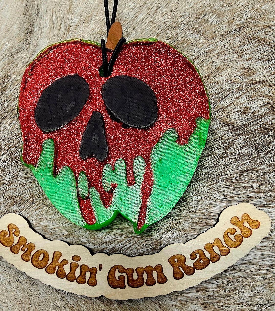 Red and green poisoned apple skull freshie on faux fur