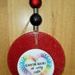 Red round cardstock freshie with winter graphic and beads