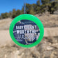 Green round cardstock freshie with baby-themed graphic