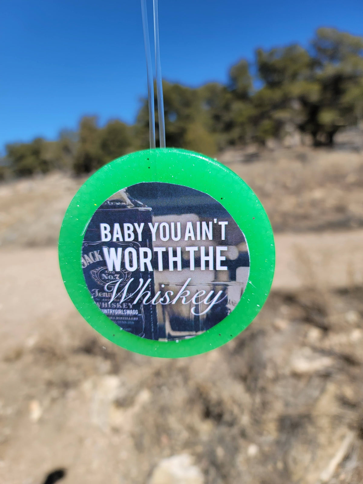 Green round cardstock freshie with baby-themed graphic