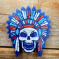 Blue and orange skull headdress freshie on wood