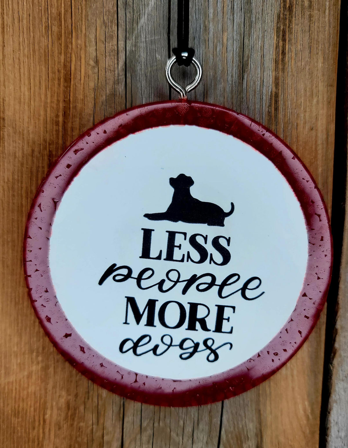 Pink round cardstock freshie reading Less People More Dogs