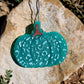 Teal leopard print pumpkin freshie hanging outdoors