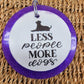 Purple round cardstock freshie reading Less People More Dogs