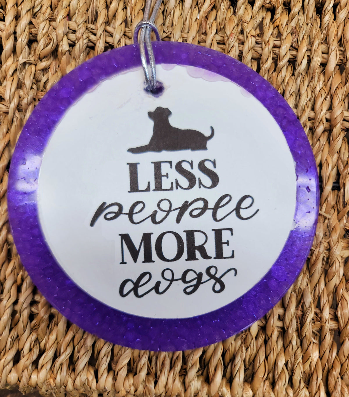 Purple round cardstock freshie reading Less People More Dogs