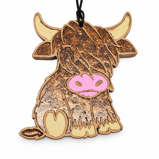 Sitting Highland Cow Freshie handmade car freshie on a clean white background